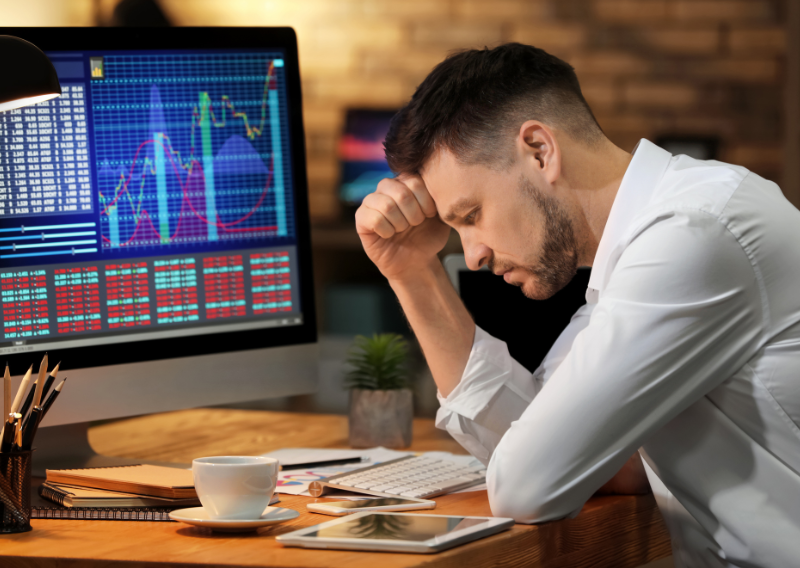 Frustrated trader facing losses, why picking the best forex broker matters in your trading journey.