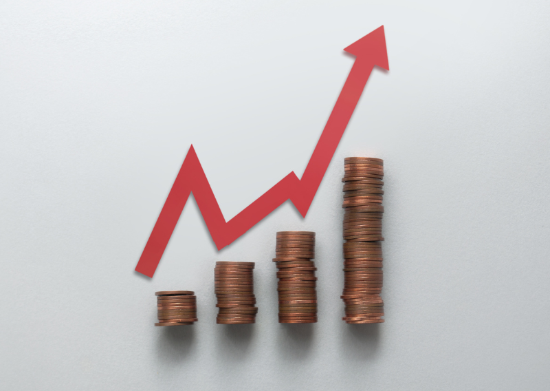 Rising stack of coins with upward arrow symbolizing inflation, investment growth, or forex profit trends