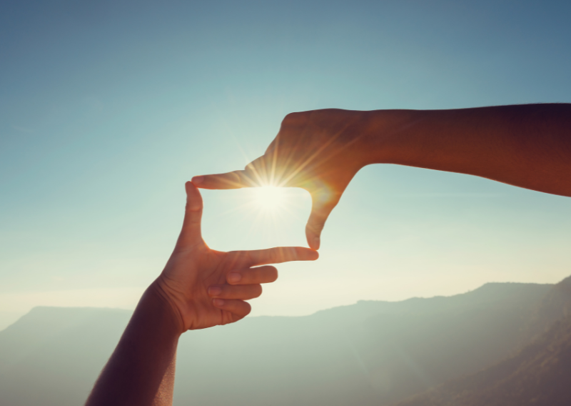 A person looking at the sun